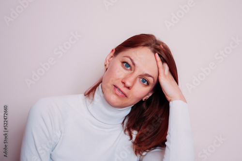 Tableau sur toile Portrait of a blue-eyed woman. Girl with red hair.