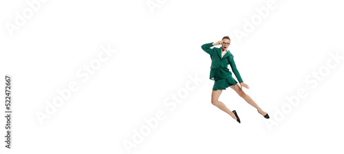 Flyer. Stylish young woman in business style outfit in motion isolated over white background. Emotions, finance, aspiration, business, job concept.