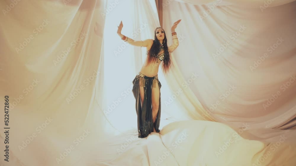 Sensual woman dancing in thin fabrics Sensual woman dancing in thin fabrics