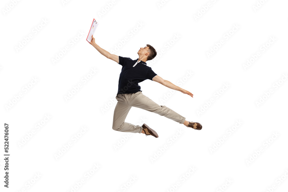 Reading contract. Composed man, young male office worker in action isolated over white background.