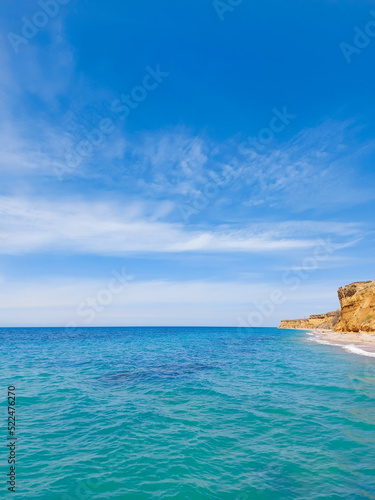 Inspiring summer sea, beach landscape view with beautiful blue sky with white clouds, sunlight and clay rocks © Vera Bel