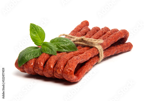 Thin Dry Smoked Pork or beef meat Polish Kabanos sausages Isolated on white background photo