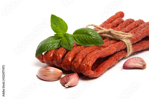 Thin Dry Smoked Pork or beef meat Polish Kabanos sausages Isolated on white background photo