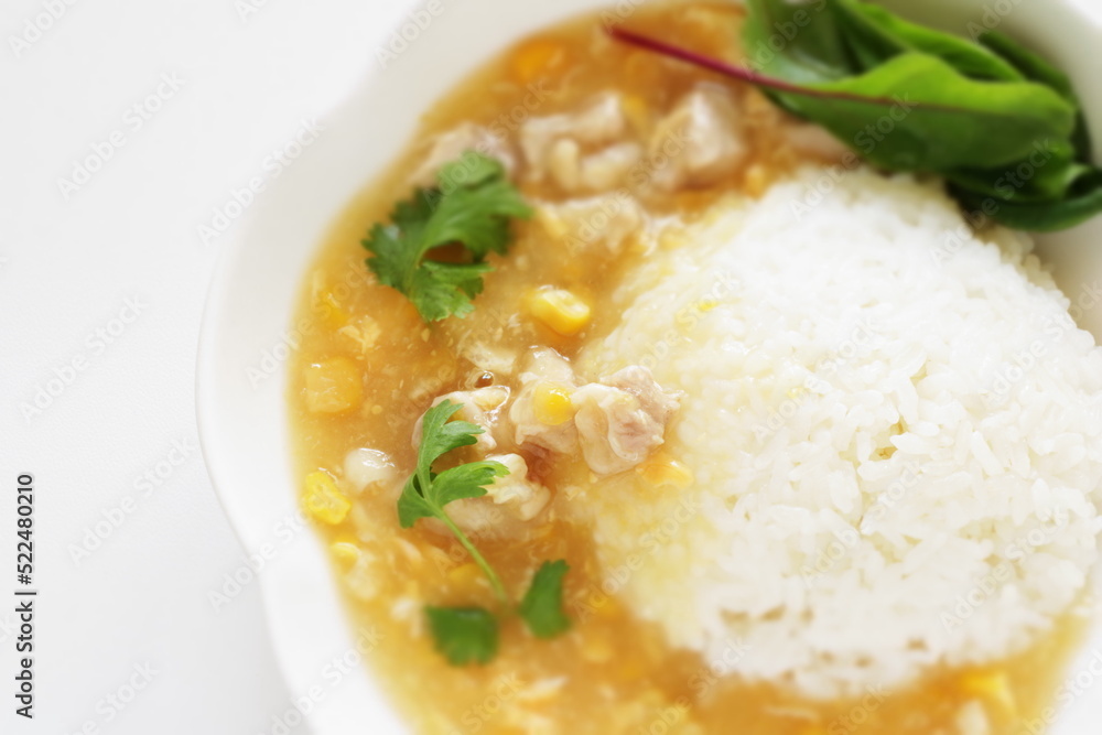 Chinese food, Chicken and sweet corn soup rice in white plate 