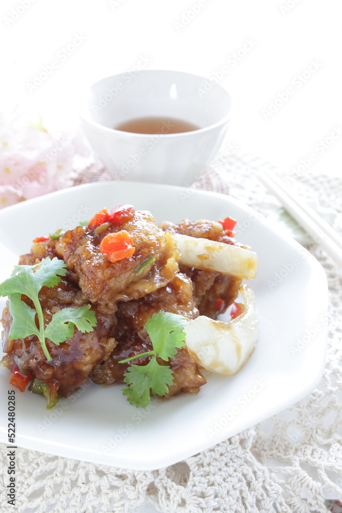 Chinese food, sour and sweet chicken with coriander leaves 