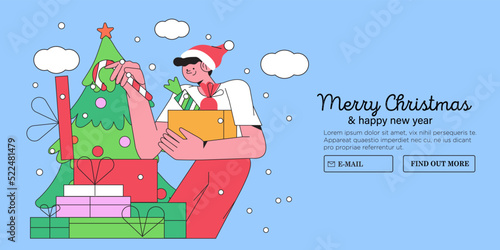 Man wearing santa claus hat prepare presents or gift for his relatives, family, wife, children or coworkers. Christmas or new year shopping and gifts praparation concept for website banner background.