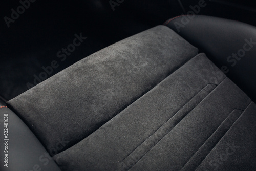 Grey alcantara texture. Close-up car seat fabric material. The surface of leatherette for textured background.  photo