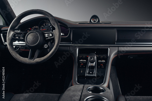 Modern SUV car interior with the leather panel, multimedia, and dashboard 