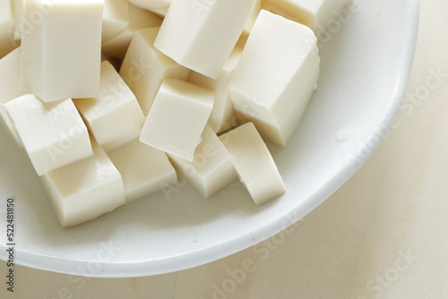 chopped Tofu on white dish with copy space for cooking ingredient 