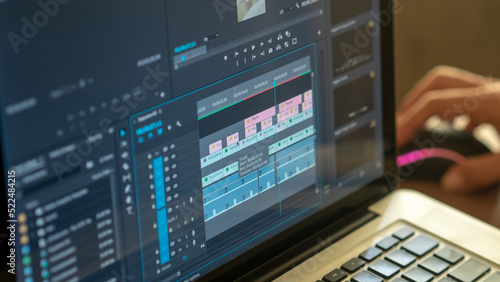 Fotografie video editting timeline with hand hold mouse