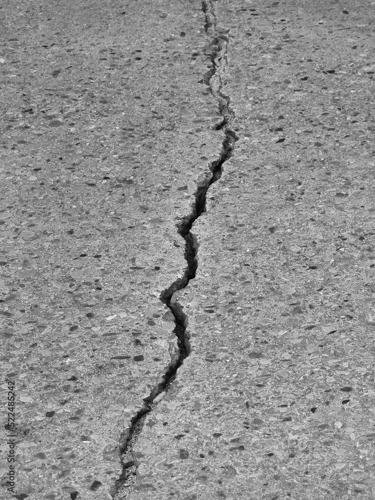 Obraz premium large crack concrete road texture
