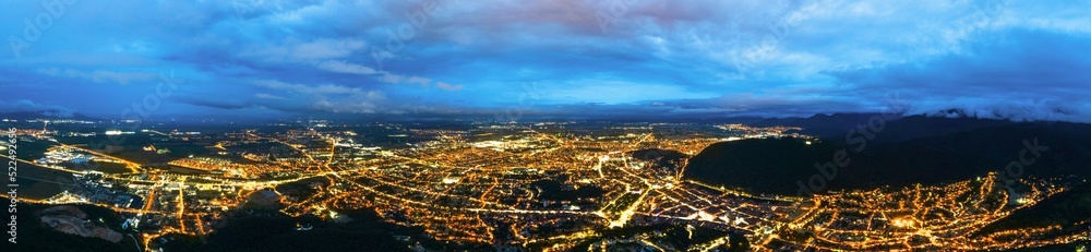 Aerial drone view of Brasov at night, Romania