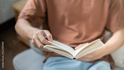 Men reading book and relaxing at home and comfort in front of opened book
