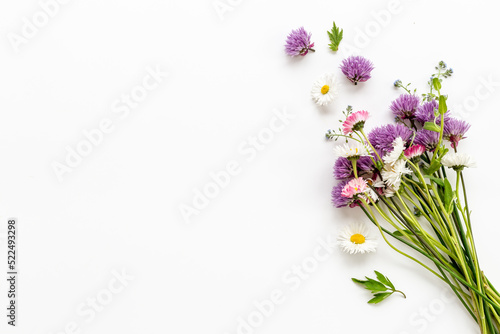 Bunch of wild meadow flowers and herbs chamomile  cornflower and ranunculus. Summer floral background