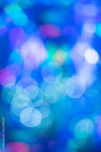 Blue white bokeh on on brigt backgroud. Abstract, Festive, winter design with bright circles particles.