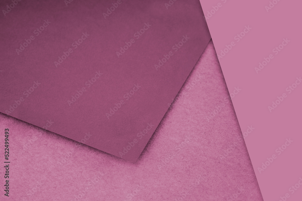 Plain and Textured pink peach purple papers randomly laying to form M like pattern and triangle for creative cover design idea Plain and Textured pink peach purple papers randomly laying to form M like pattern and triangle for creative cover design idea