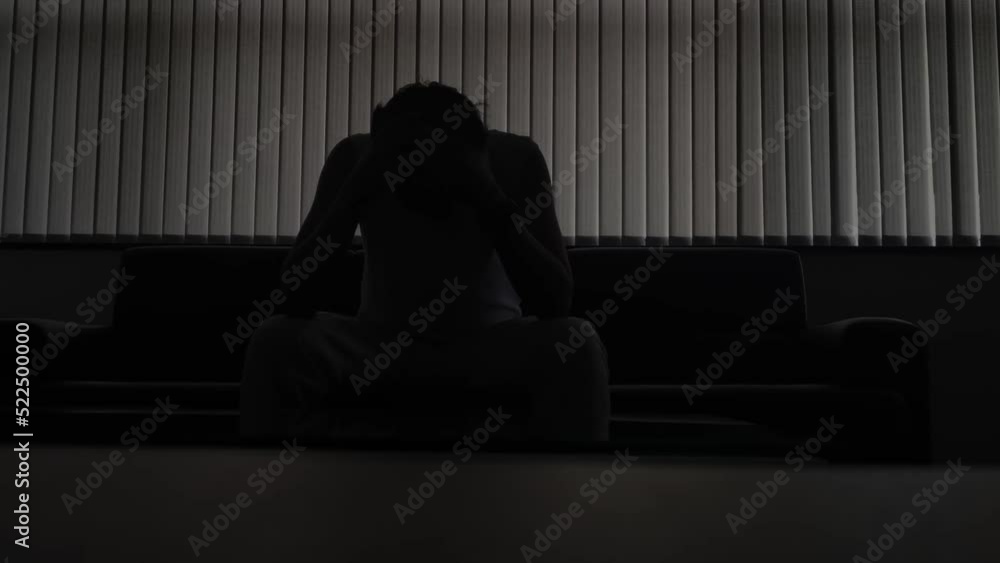 stressed man in a dark room stressed man in a dark room