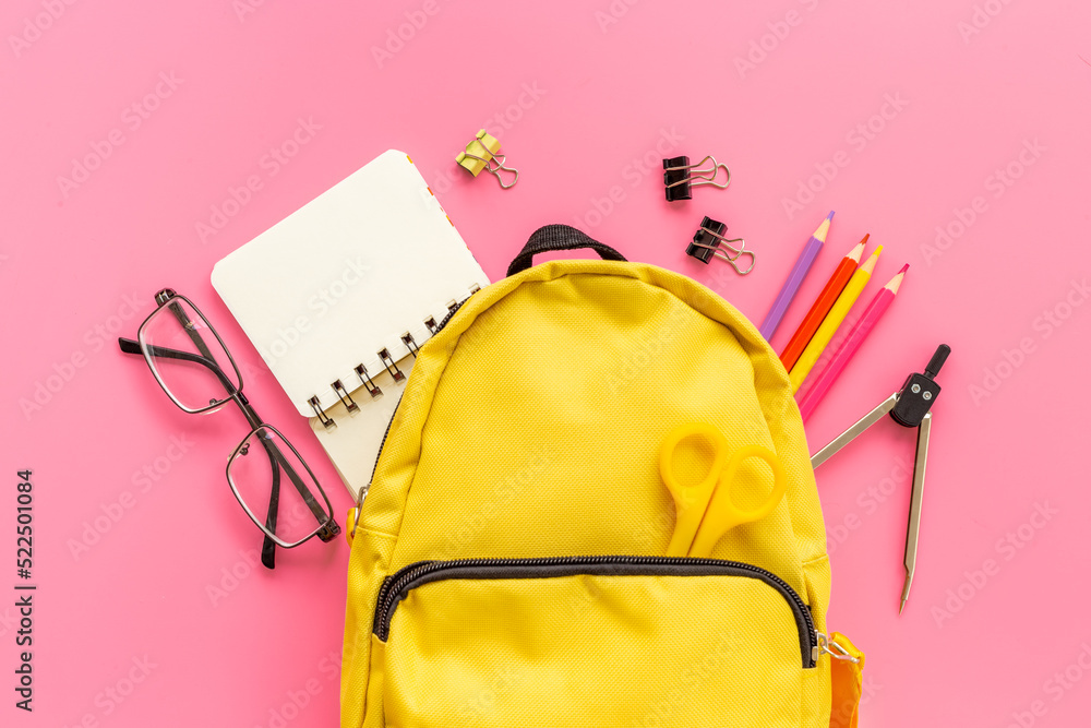 Educational objects top view. School backpack with colorful stationery Educational objects top view. School backpack with colorful stationery