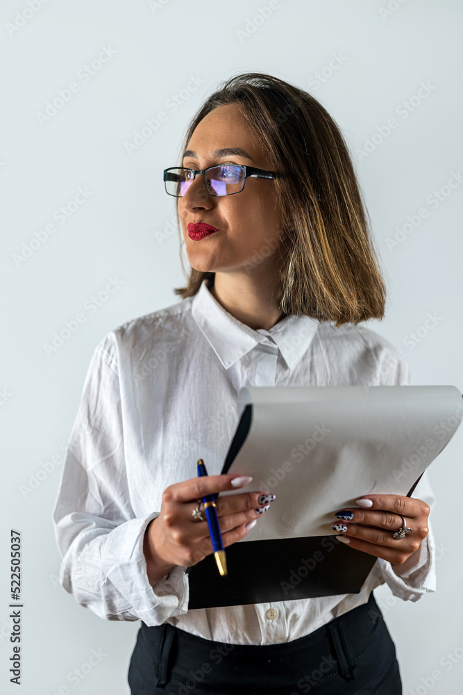 Happy smiling cheerful young business woman with clipboard isolated on white background.