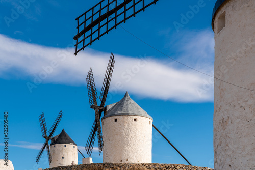 Beautiful wind mill isolated in top of a hill near to Consuegra city in Castilla-La Mancha - Spain. Cloudy day.