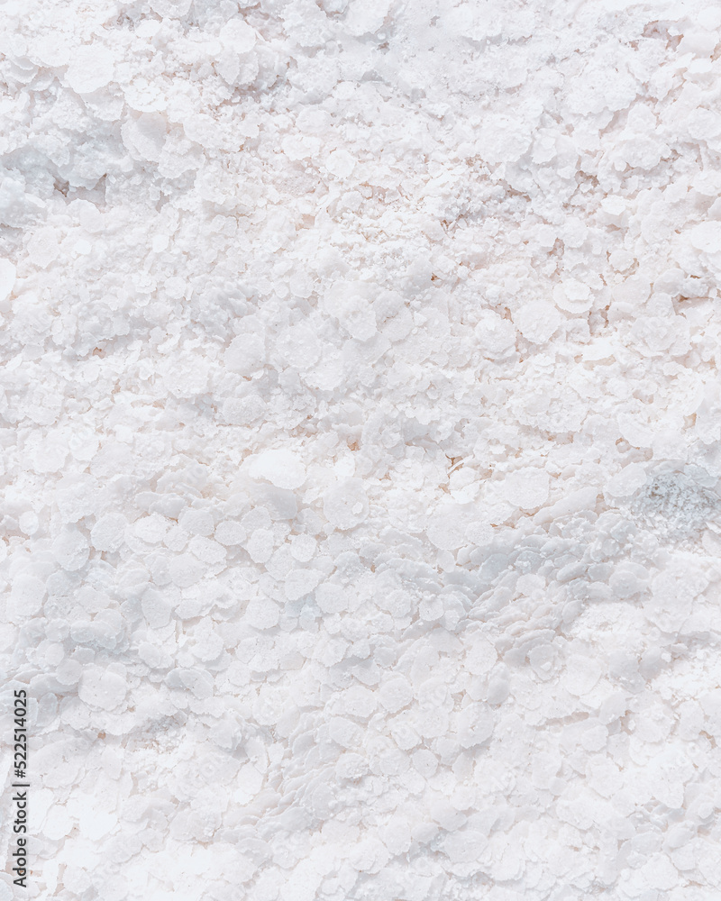 Salt flakes on white surface Salt flakes on white surface