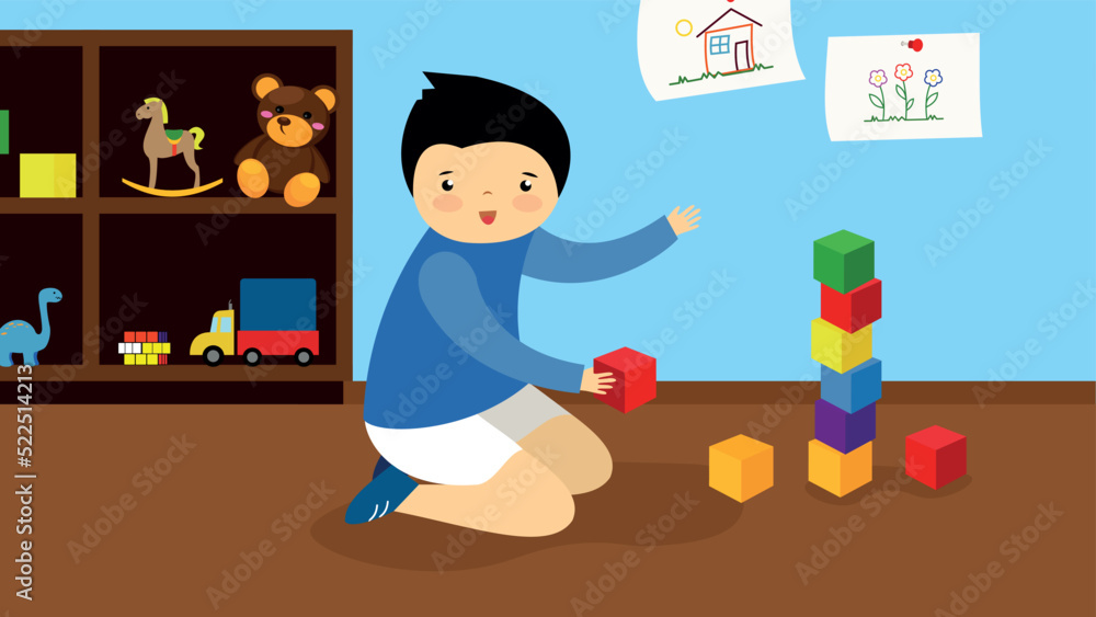 A boy builds a tower of blocks on the floor A boy builds a tower of blocks on the floor