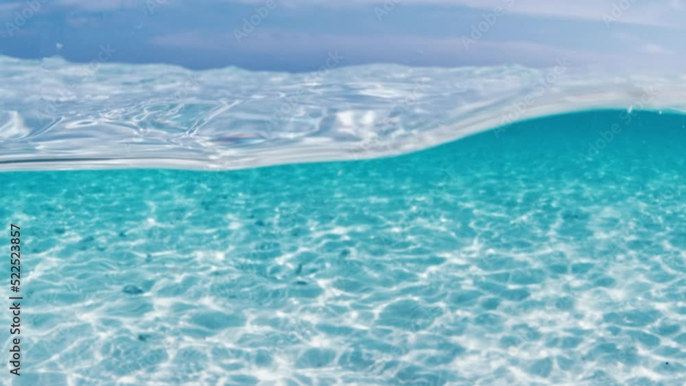 Tropical blue sea. Splitted view of the tropical beach and the sea in the Maldives Tropical blue sea. Splitted view of the tropical beach and the sea in the Maldives