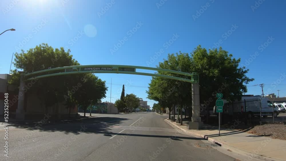 Fresno, California, USA, June 26, 2022: DOLLY SLOW MOTION SHOT - Downtown Fresno Welcome Sign at Van Ness Avenue. Fresno, California, USA, June 26, 2022: DOLLY SLOW MOTION SHOT - Downtown Fresno Welcome Sign at Van Ness Avenue.