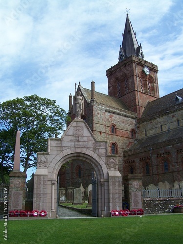 St Magnus Cathedral in Kirkwall, Orkney Islands, Scotland, United Kingdom, in the foreground the entrance to the graveyard