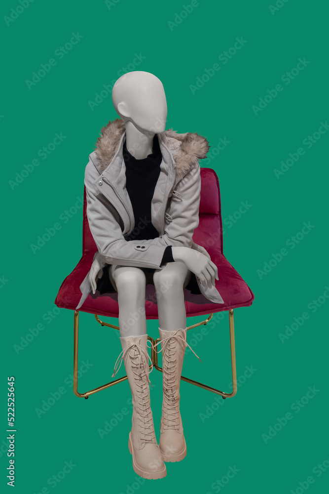 Female mannequin sitting on chair Stock Photo | Adobe Stock