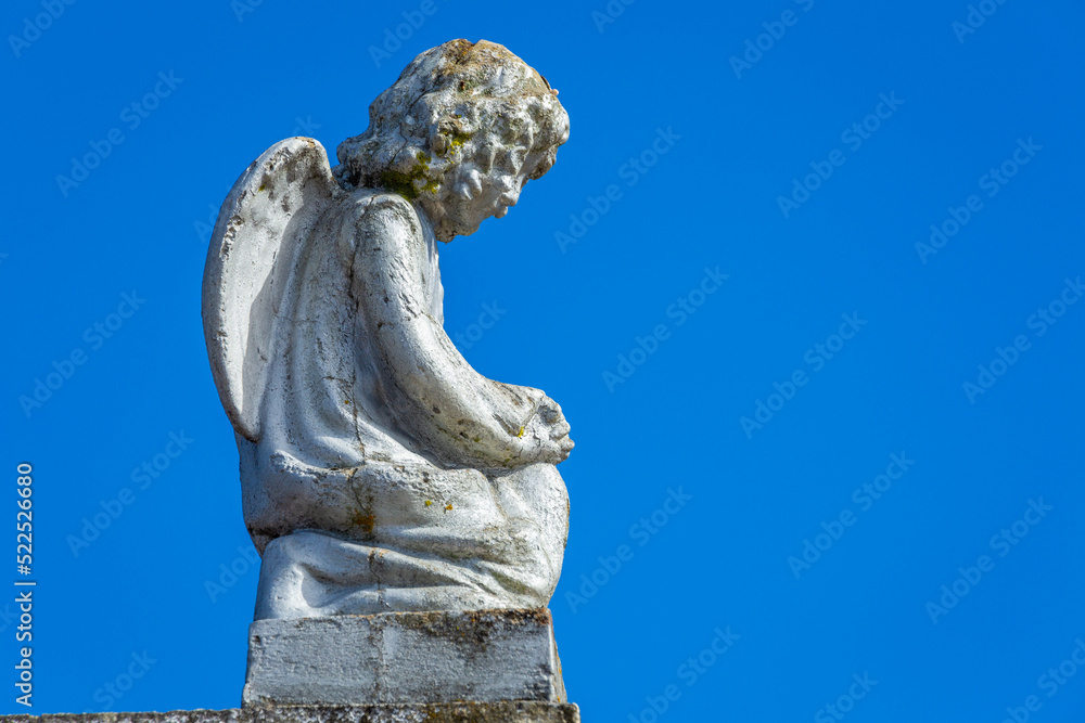 Seraphim angel praying with hands clasped for faith and hope of better days