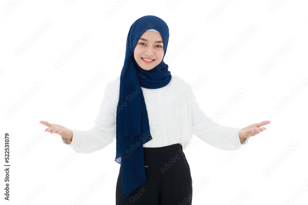A young, beautiful young Asian Muslim woman wearing a headscarf is showing open and welcoming gestures with a happy, friendly smile on her face.