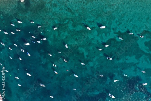 Boats floating on a crystal clear water in a vacation resort