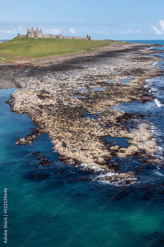 Obraz premium Dunstanburgh Castle from the sea elevated