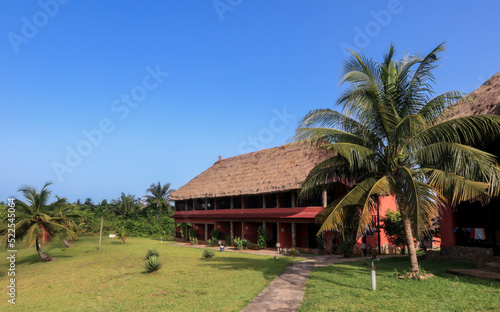 Traditional African Houses on the Axim Tropical Beach in Ghana, West Africa