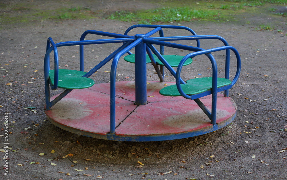 Children's carousel on the playground in the yard Children's carousel on the playground in the yard