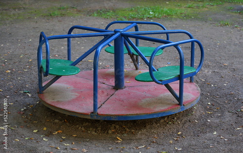 Children's carousel on the playground in the yard