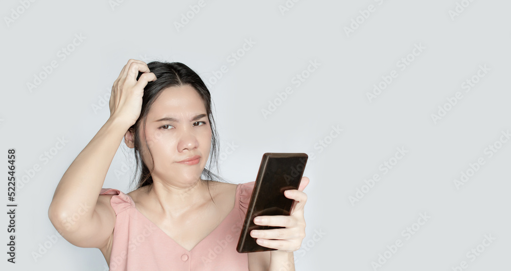 Asian beautiful woman are confused and disappointed and bad experience using WIFI or online or social activity via smartphone Asian beautiful woman are confused and disappointed and bad experience using WIFI or online or social activity via smartphone