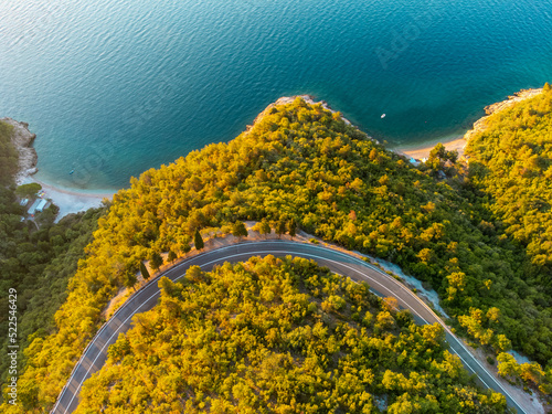 Winding coastal road at sunrise