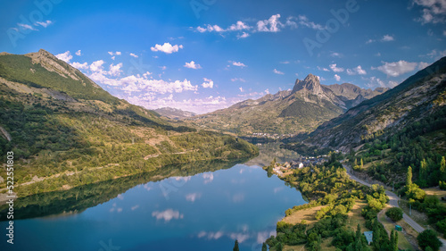 Fototapeta Naklejka Na Ścianę i Meble -  Landscape of a mountain reflected in a lake on a sunny summer morning