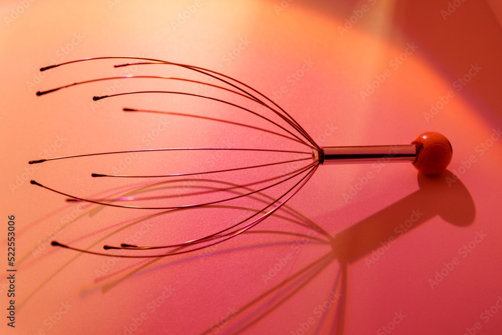 A head massager. Manual device for home and professional massage. Selective focus A head massager. Manual device for home and professional massage. Selective focus
