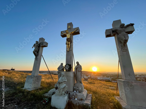 jesus crosses on the hill in sunset