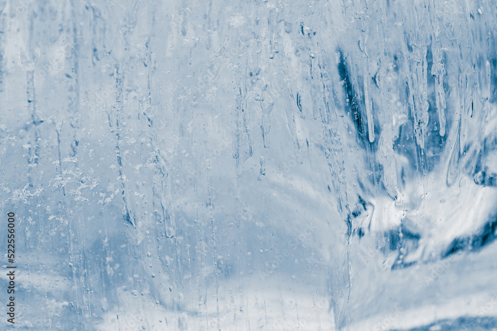 Block of pure transparent ice in cold blue tones. Ice structure. Block of pure transparent ice in cold blue tones. Ice structure.