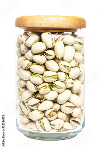 Organic pistachio nut full fill in glass bottle with wood cap on transparent background photo