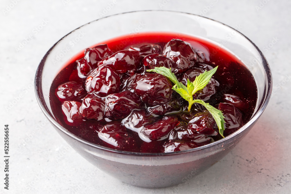 Jars with freshly homemade cherry jam, sour cherry jam, Turkish name; Visne receli Jars with freshly homemade cherry jam, sour cherry jam, Turkish name; Visne receli