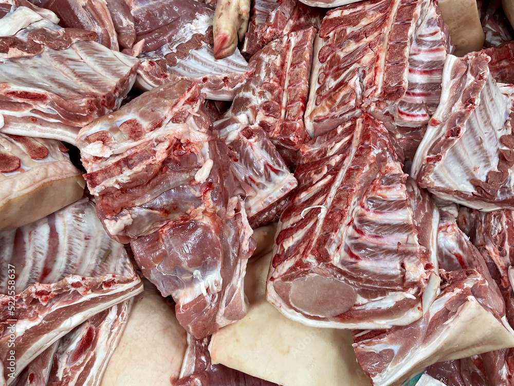 Large pieces of meat at the local market, high risk of cholesterol and saturated fat.