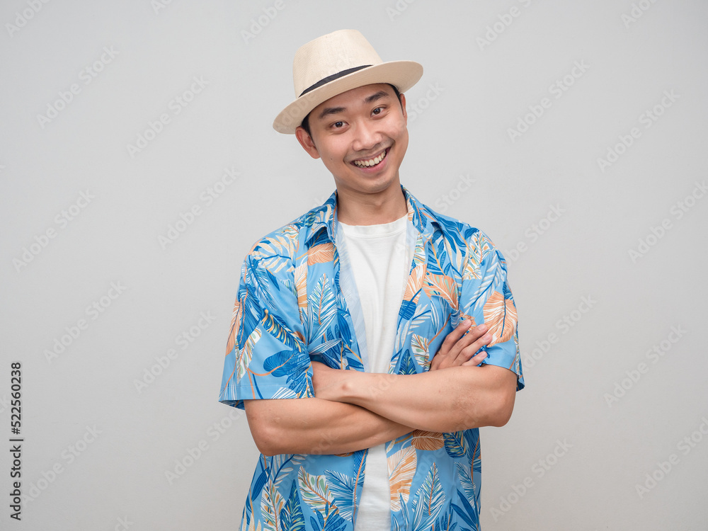 Positive man wear hat beach shirt stand cross arm gentle smile portrait Positive man wear hat beach shirt stand cross arm gentle smile portrait