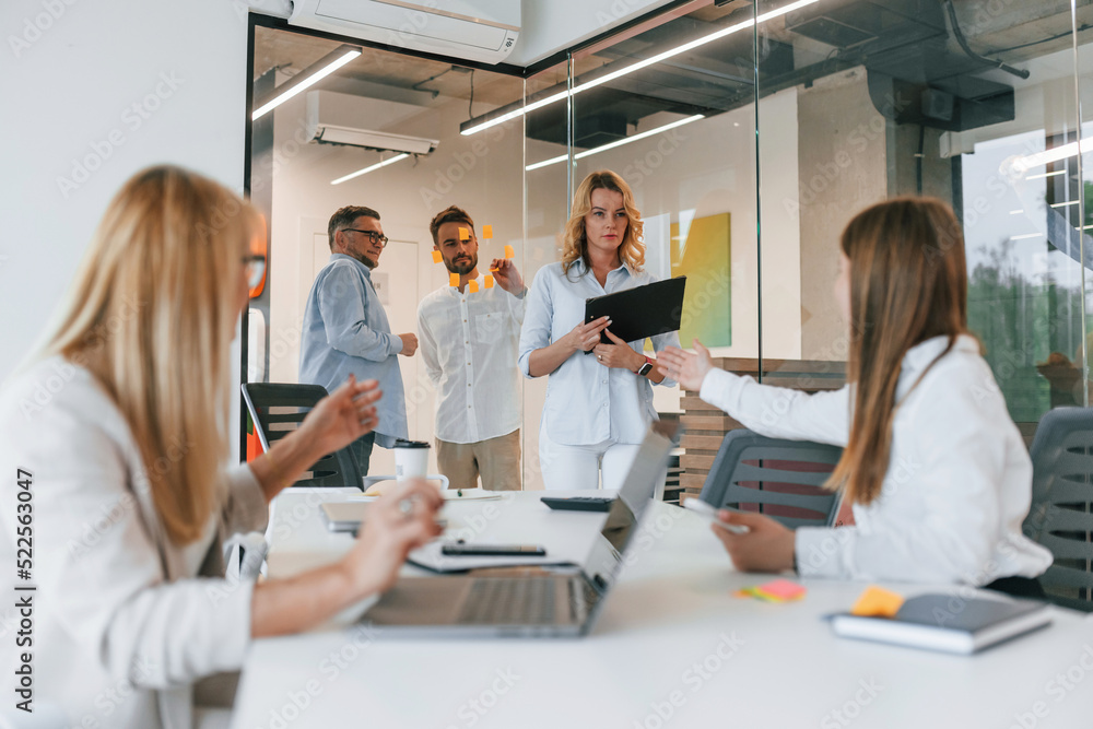 Working with project. Group of professional business people is in the office Working with project. Group of professional business people is in the office