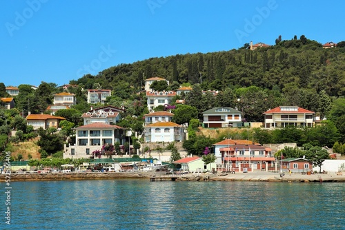 Resort village on the coast of the island, white cottages with tiled roofs