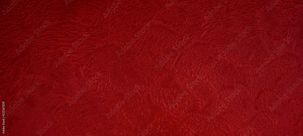 Fototapeta premium Red acrylic or oil paint texture. Closeup of the painting. Colorful abstract painting background with sponge swab
